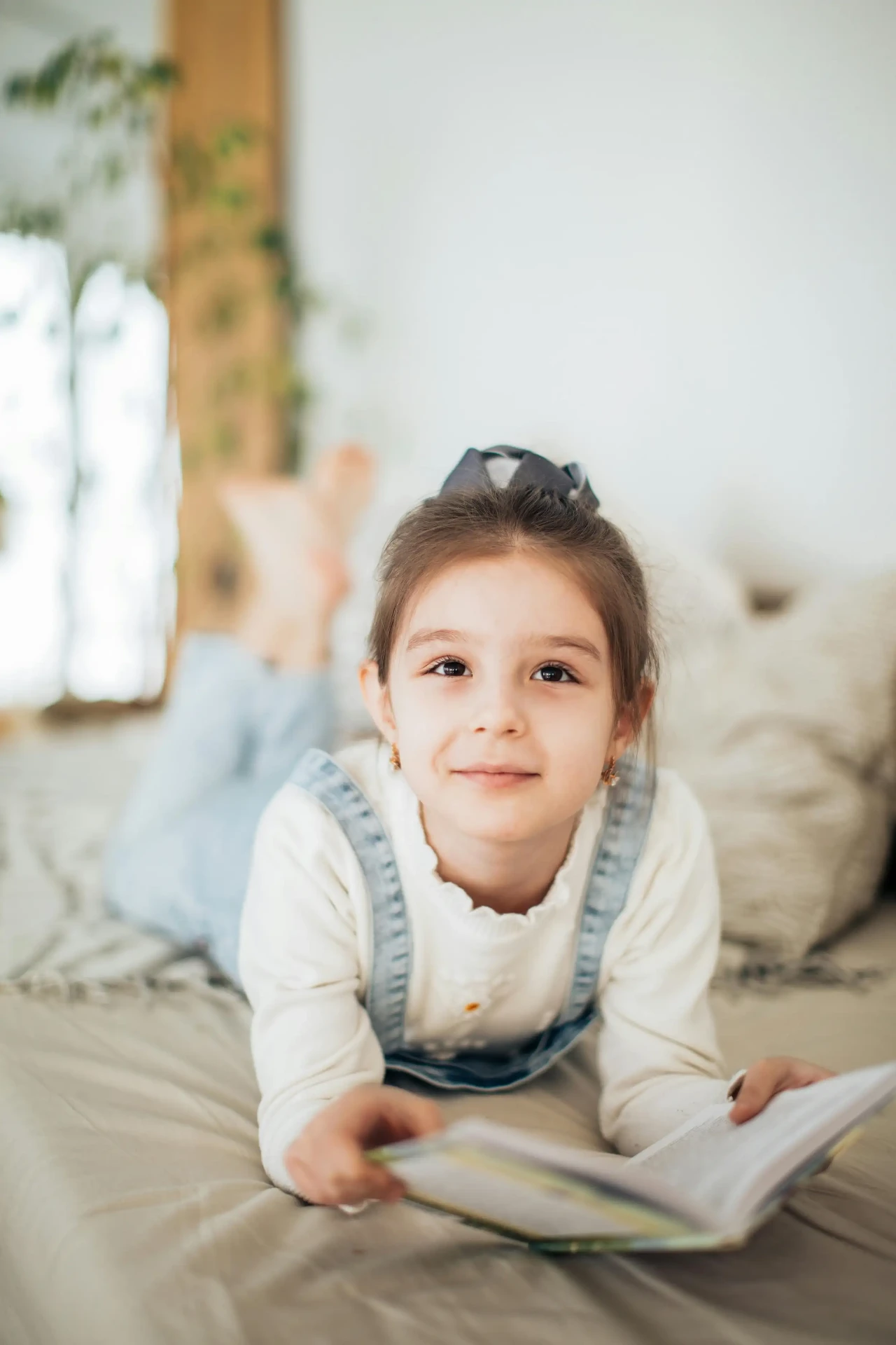 Young child focused on reading a picture book